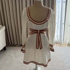 Chic White Dress with Brown Trim